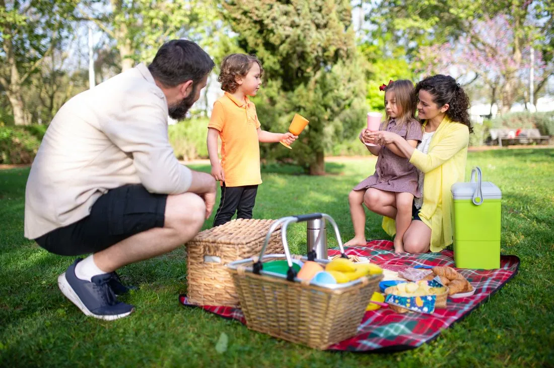 Young family walking together in a park